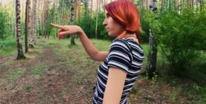Outdoors video of redhead Elin sucking a fat dick in the woods