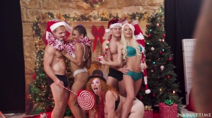 Stunning babes combine Christmas shooting with insane porno in group