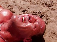 The guy was super horny and wanted anal sex on the beach with the blonde