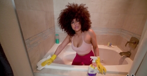 Curly ebony stops cleaning to spin some inches in that fine ass
